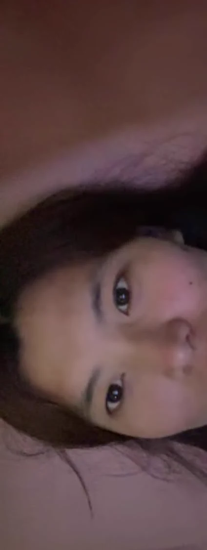 A close late-night video-call image of Sonam resting sideways.