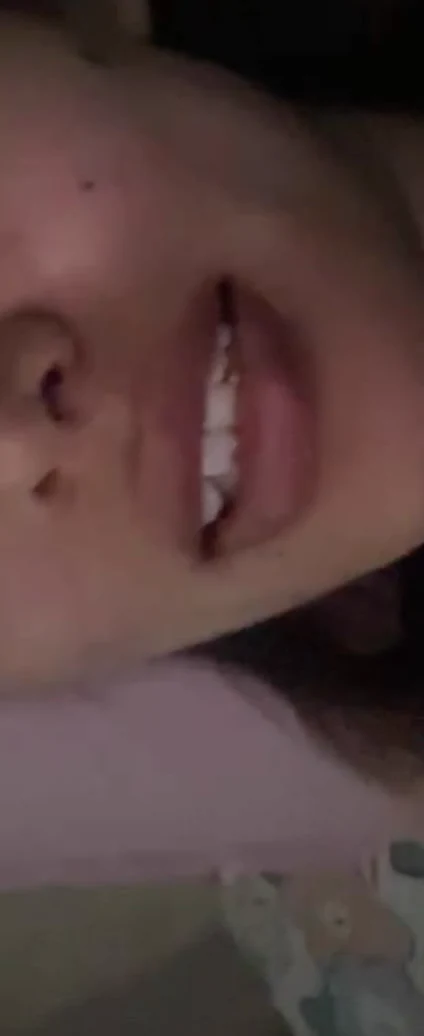 A close late-night video-call image of Sonam resting sideways.