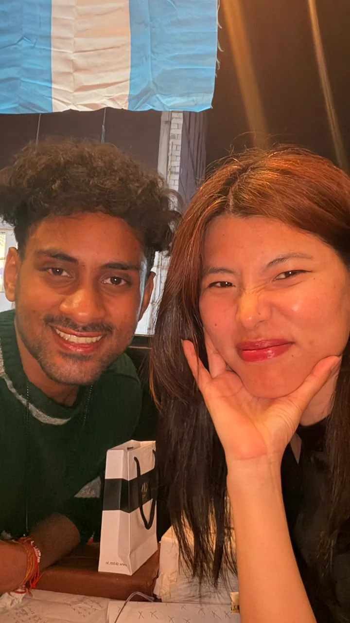 Saharsh and Sonam leaning close together for a selfie.