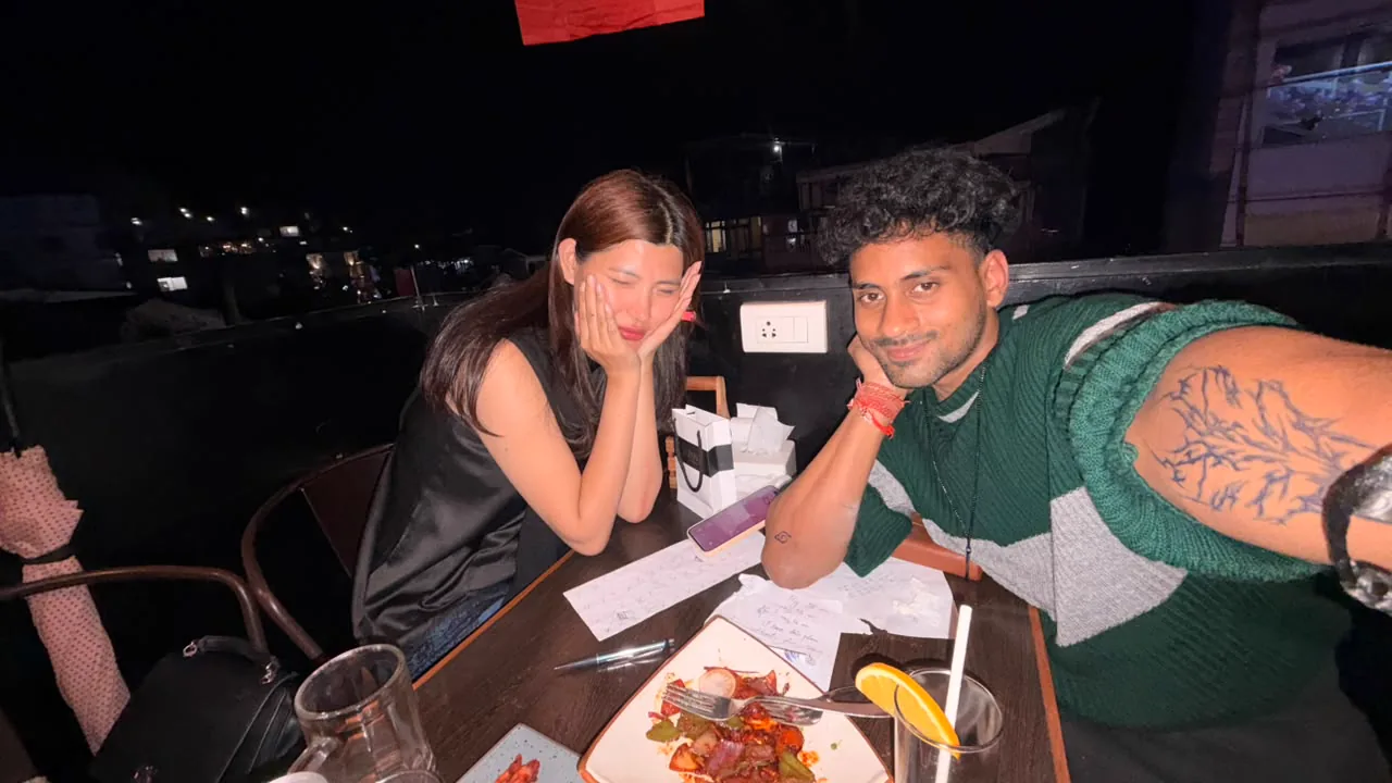Saharsh and Sonam together at the table later in the evening.